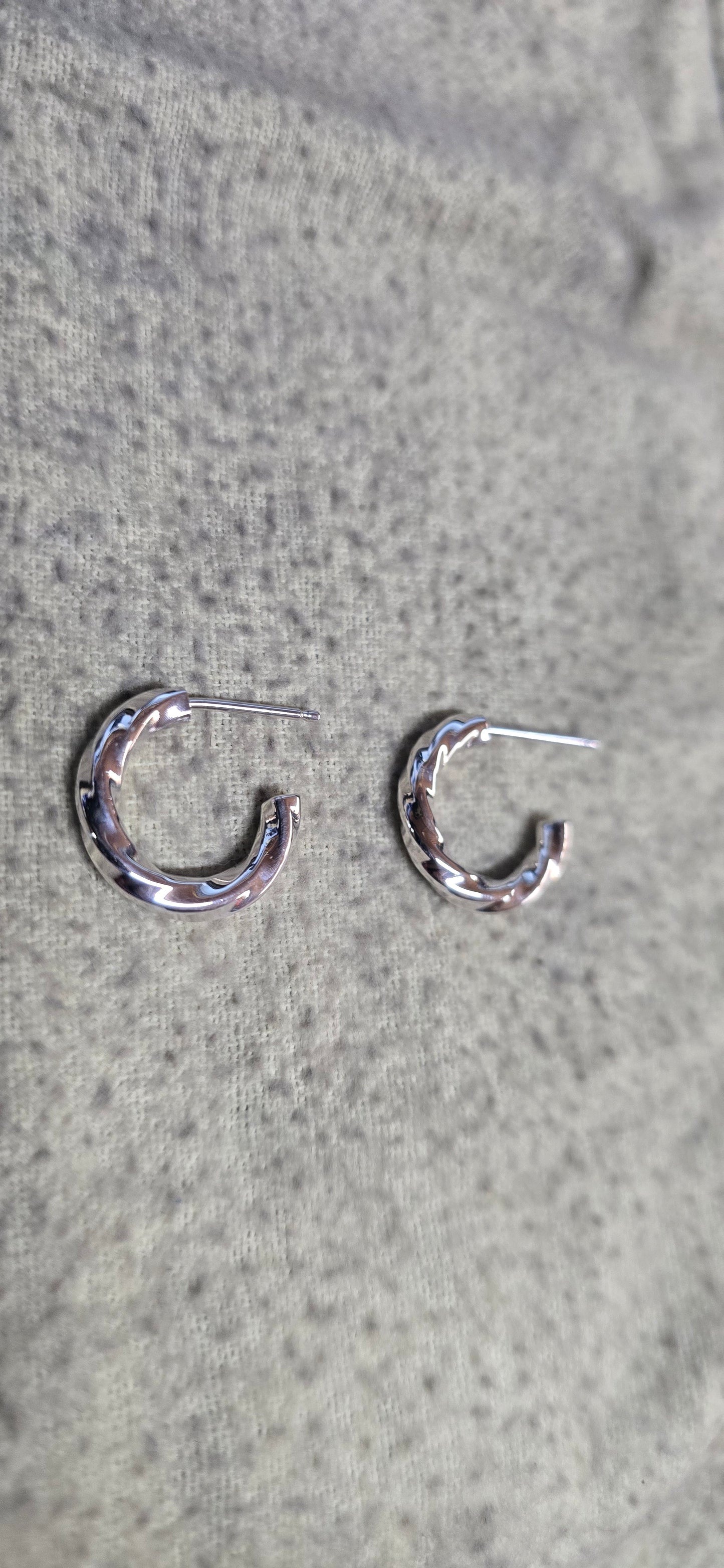 2.5 mm sterling silver twisted hoop earrings.