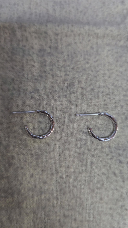 1.5mm sterling silver twisted hoop earrings.