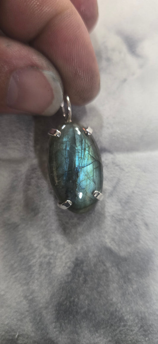 Colorful labradorite mounted in sterling silver pendant.