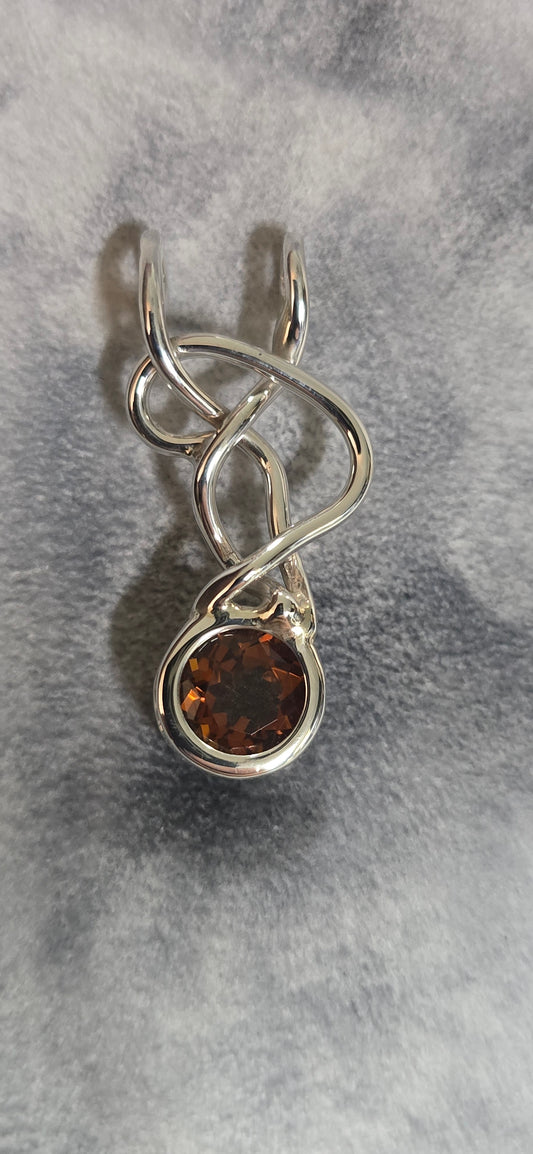 9mm citrine mounted in a sterling silver freeform pendant.