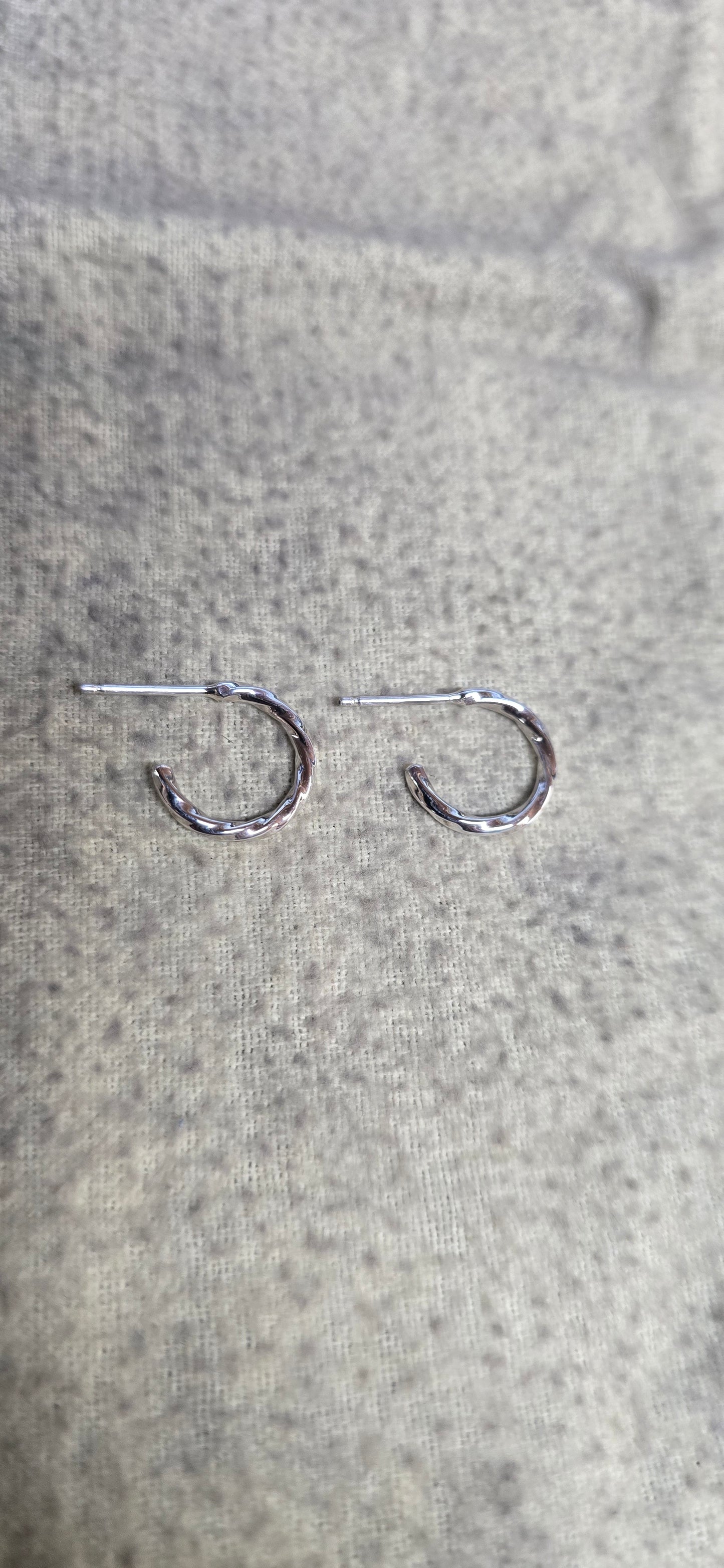 1.5mm sterling silver twisted hoop earrings.