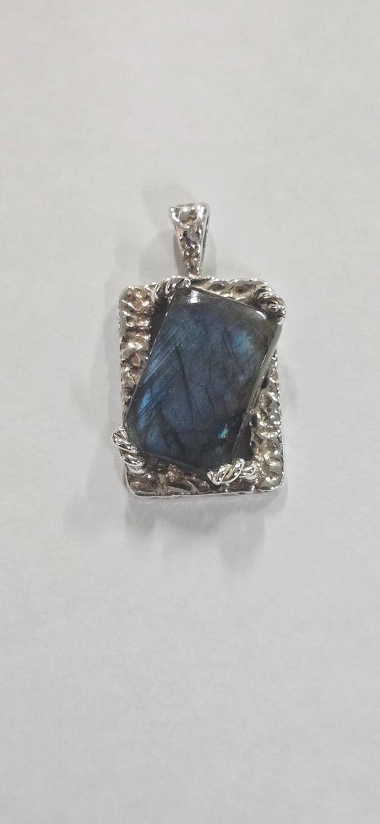 Darker blue Labradorite set in silver. Twisted