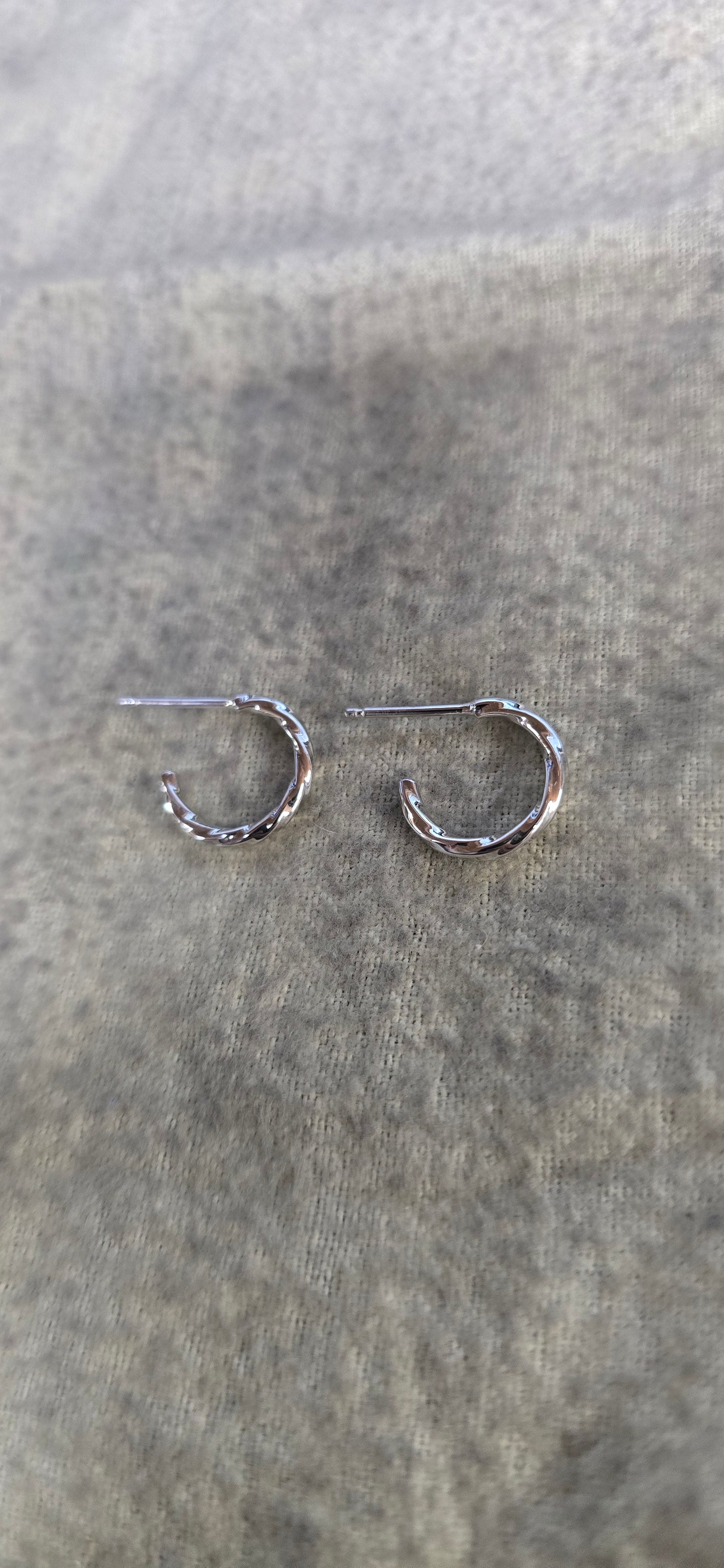 1.5mm sterling silver twisted hoop earrings.