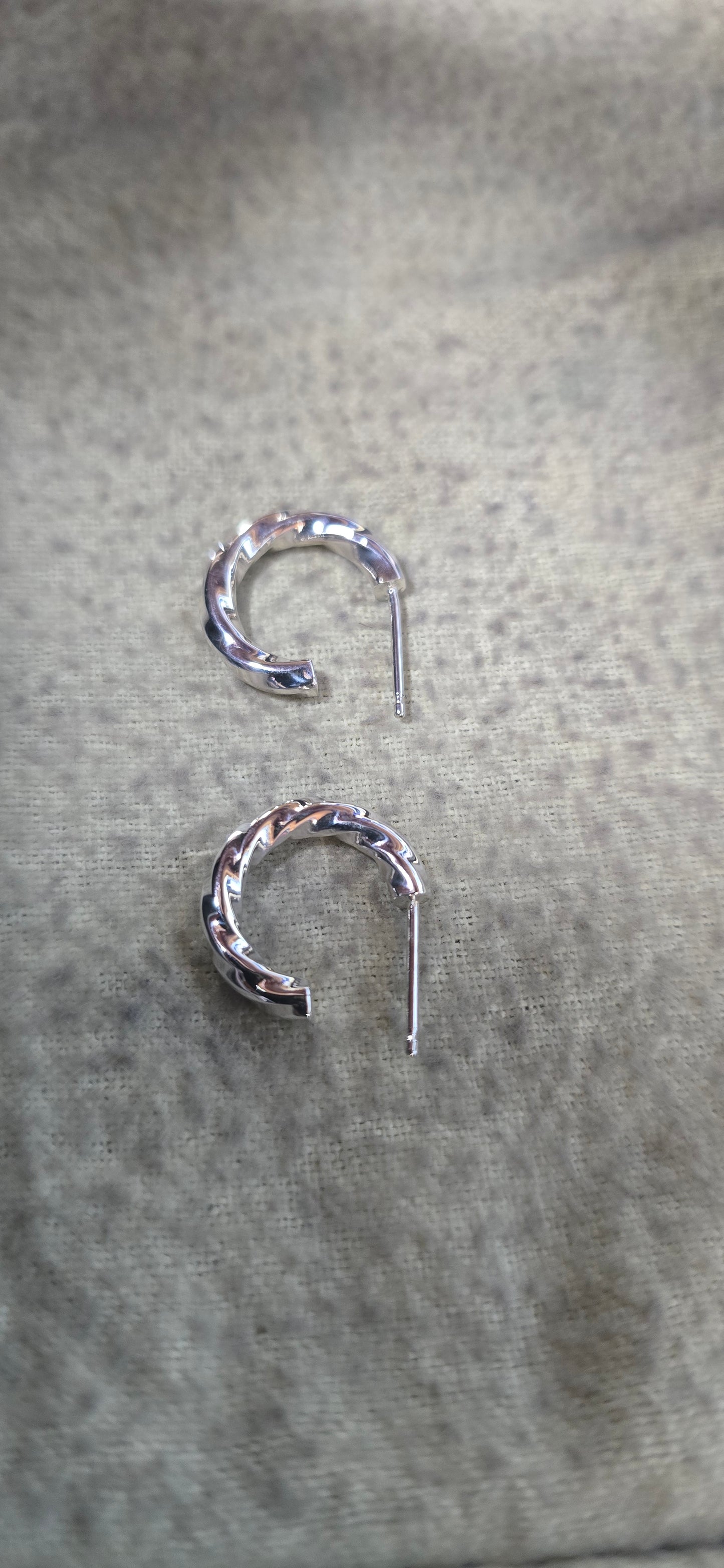 2.5 mm sterling silver twisted hoop earrings.