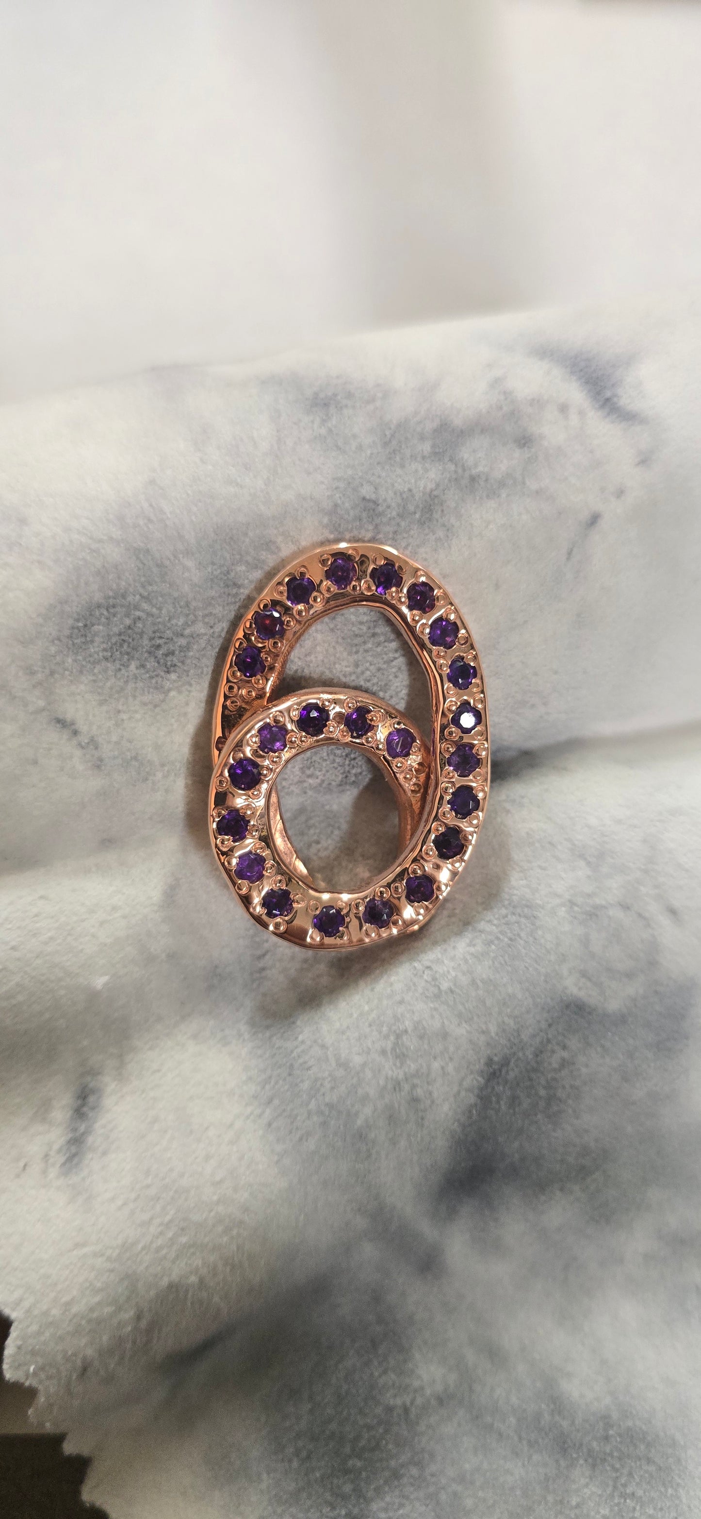 3.5mm Amethysts set in some copper pendant